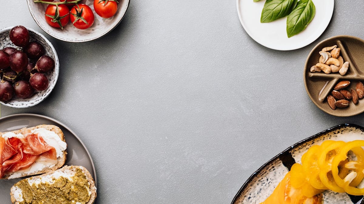 Fresh ingredients with sandwiches in a flat lay style, offering a gourmet meal concept.